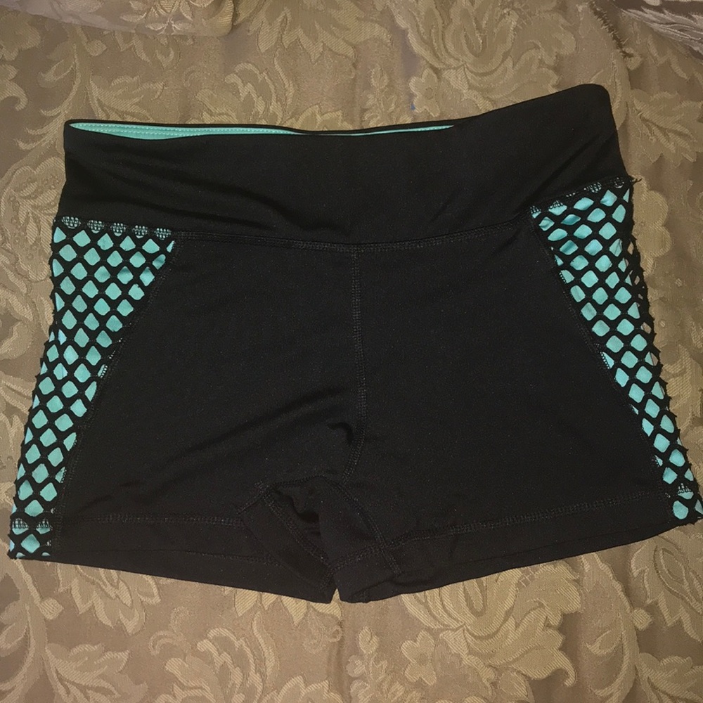 Women Black an green shorts .